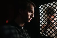 a priest listening to the person confessing